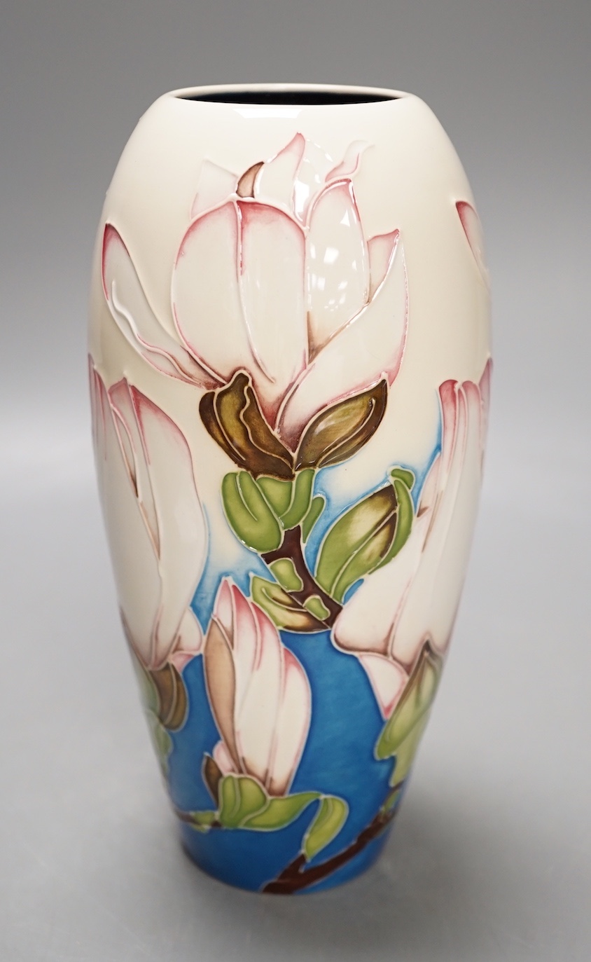 A Moorcroft 'sunshine magnolia' vase by Paul Hilditch, limited edition 10/100, 2011, boxed, 18.5 cms high.